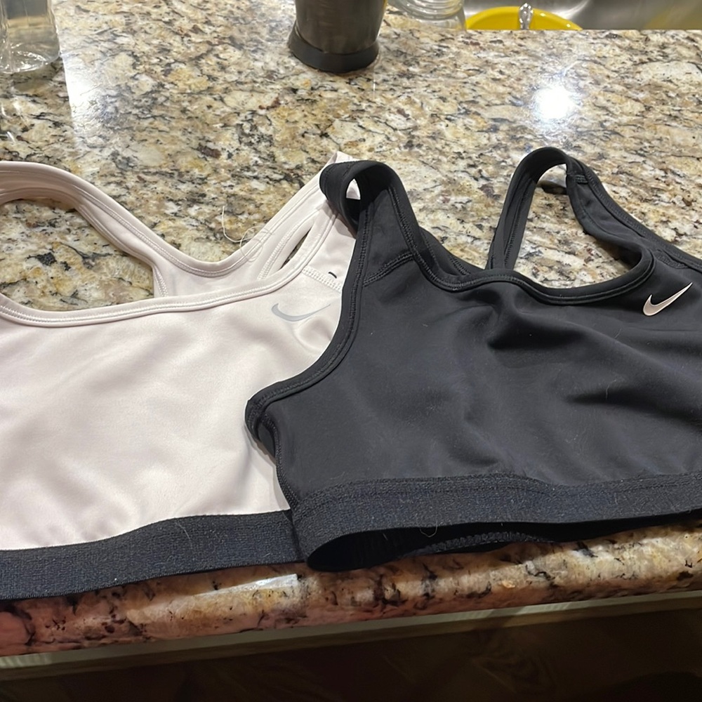 Two Nike youth large sports bras